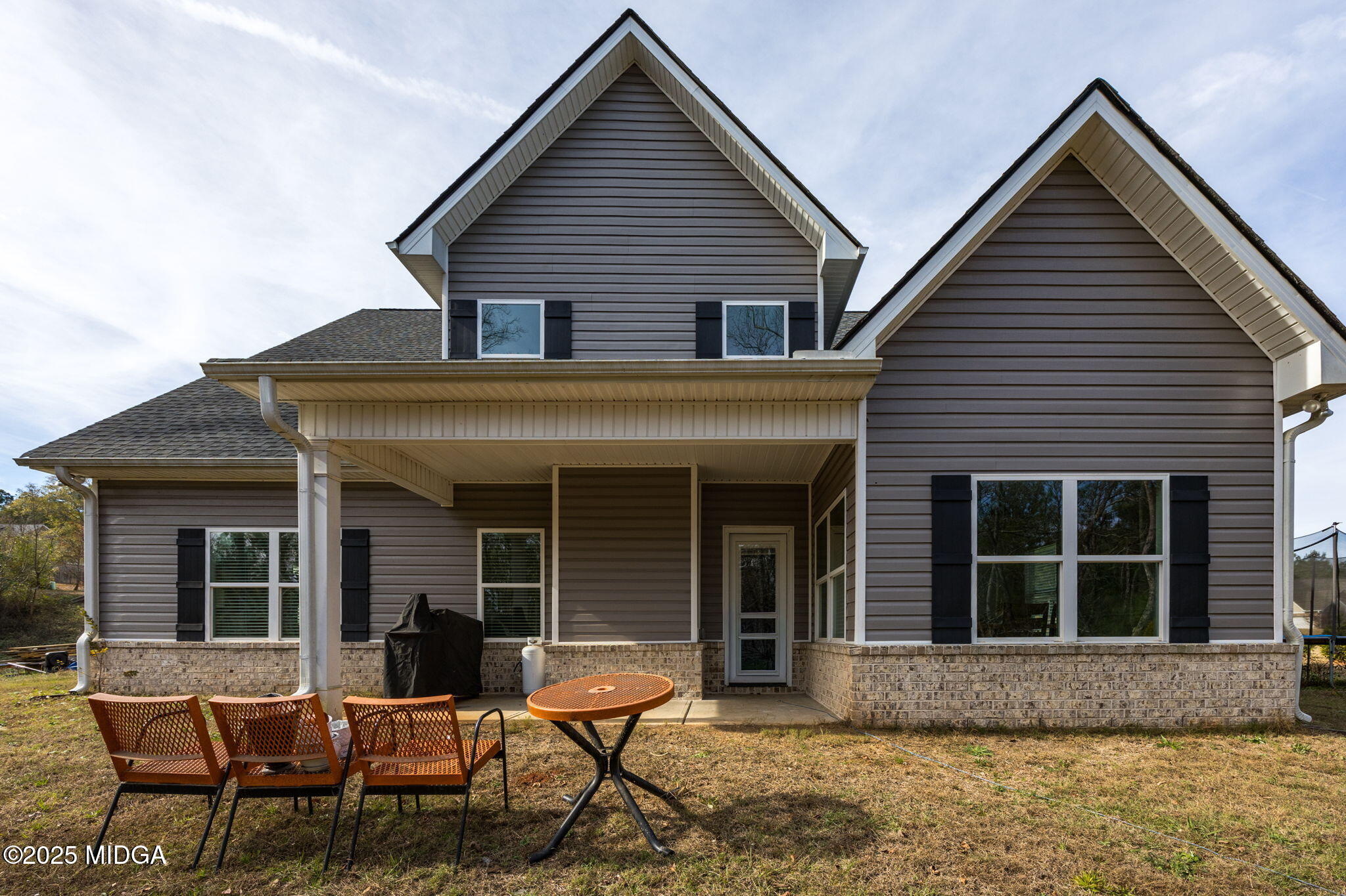 153 Jackson Drive Forsyth, GA 31029 - Photo 23 of 26 a view of a house with a yard and sitting area