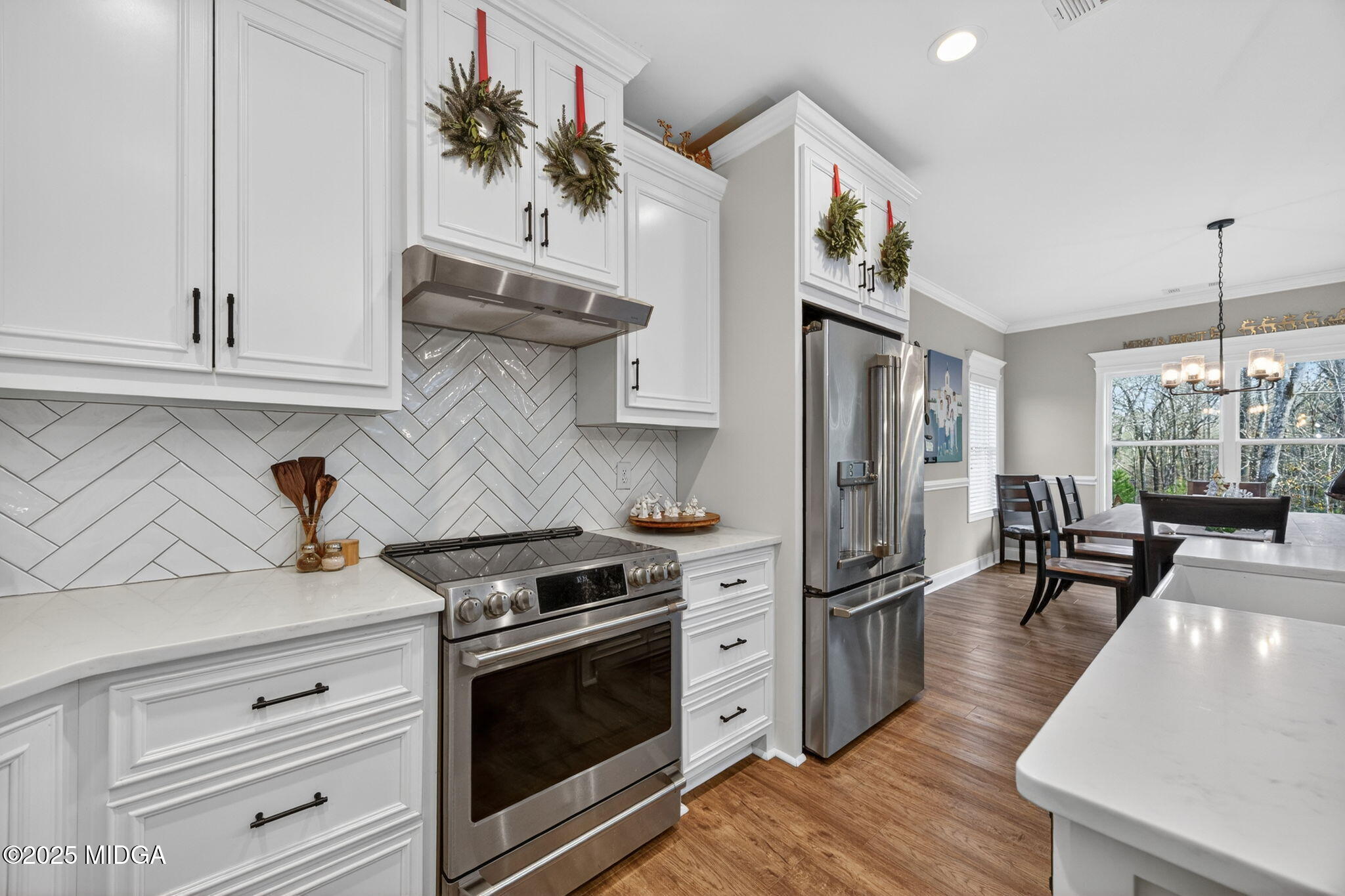 153 Jackson Drive Forsyth, GA 31029 - Photo 4 of 26 a kitchen with stainless steel appliances granite countertop a stove and a refrigerator