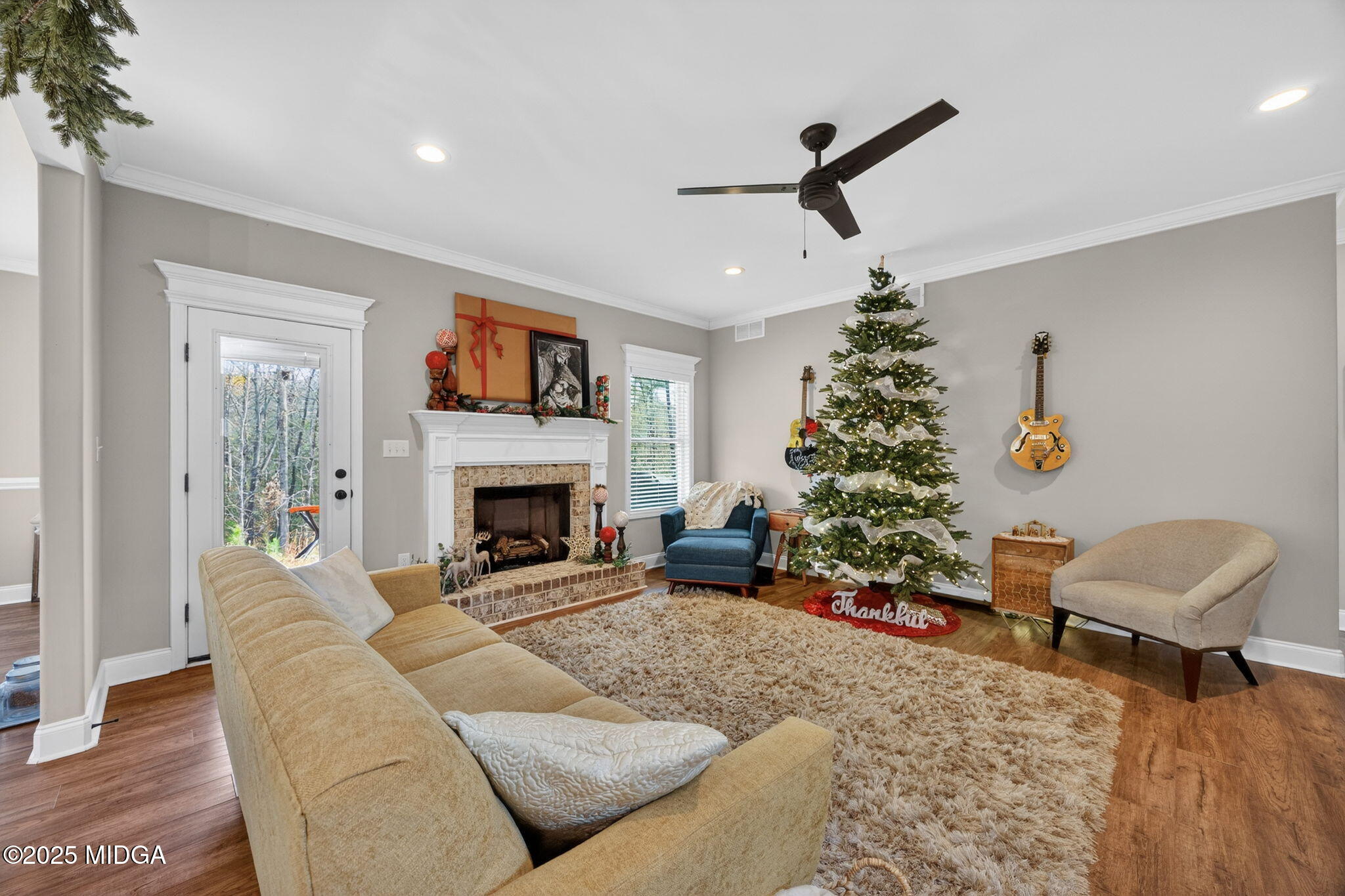 153 Jackson Drive Forsyth, GA 31029 - Photo 10 of 26 a living room with furniture and a fireplace