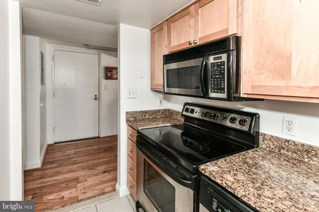 a kitchen with a stove and a microwave