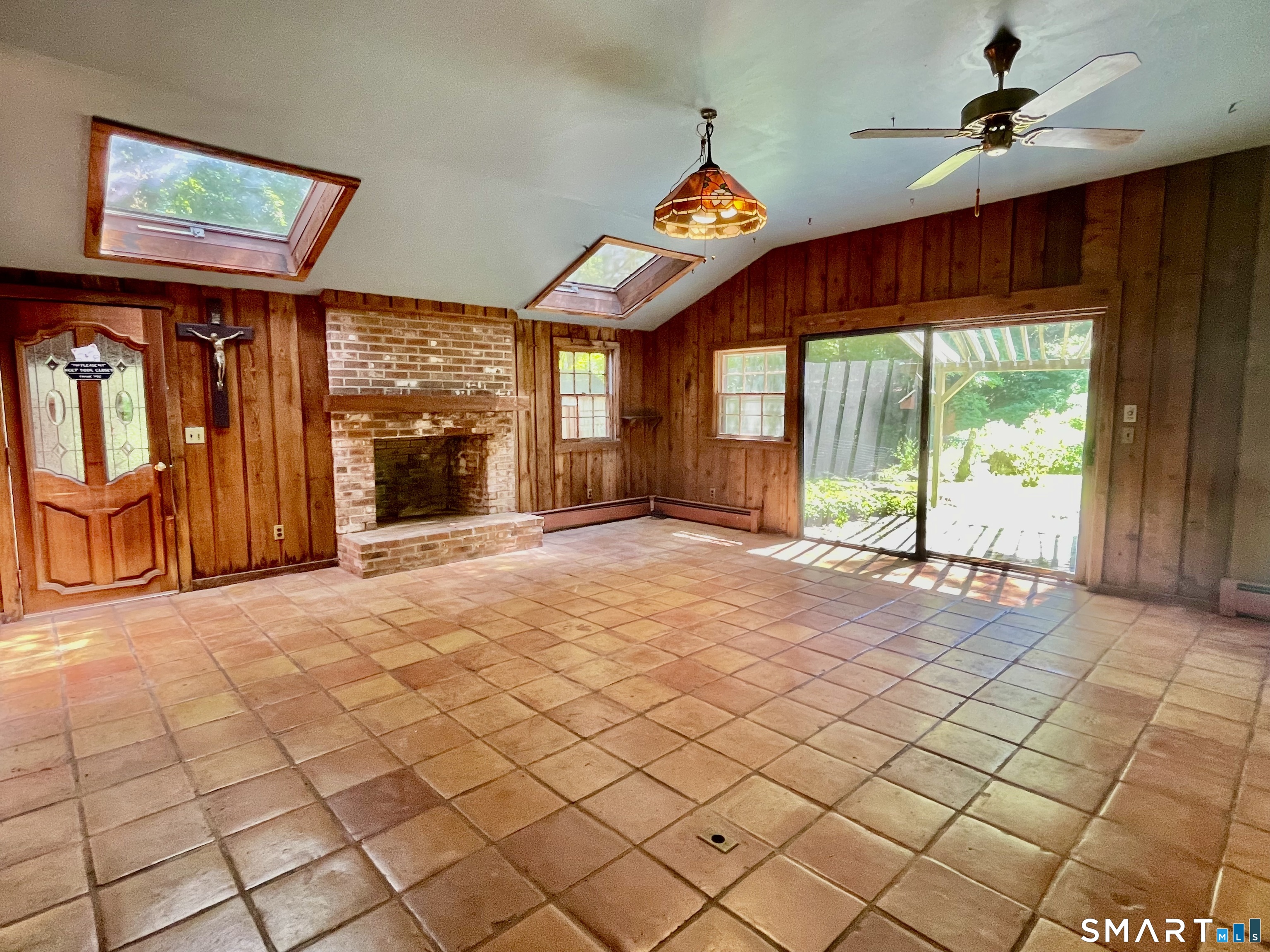 11 Tubbs Spring Drive Weston, CT 06883 - Photo 11 of 36 The vaulted ceiling with 2 big skylights and slider flood the room with natural light