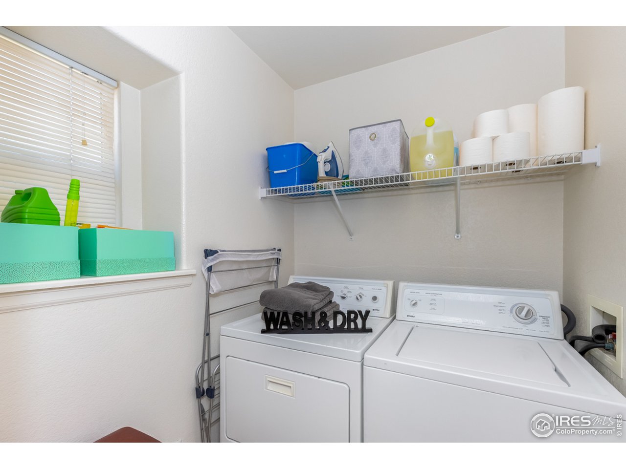 6827 Autumn Ridge Drive, Unit 3 Fort Collins, CO 80525 - Photo 13 of 35 Separate Laundry Room with bright window & storage
