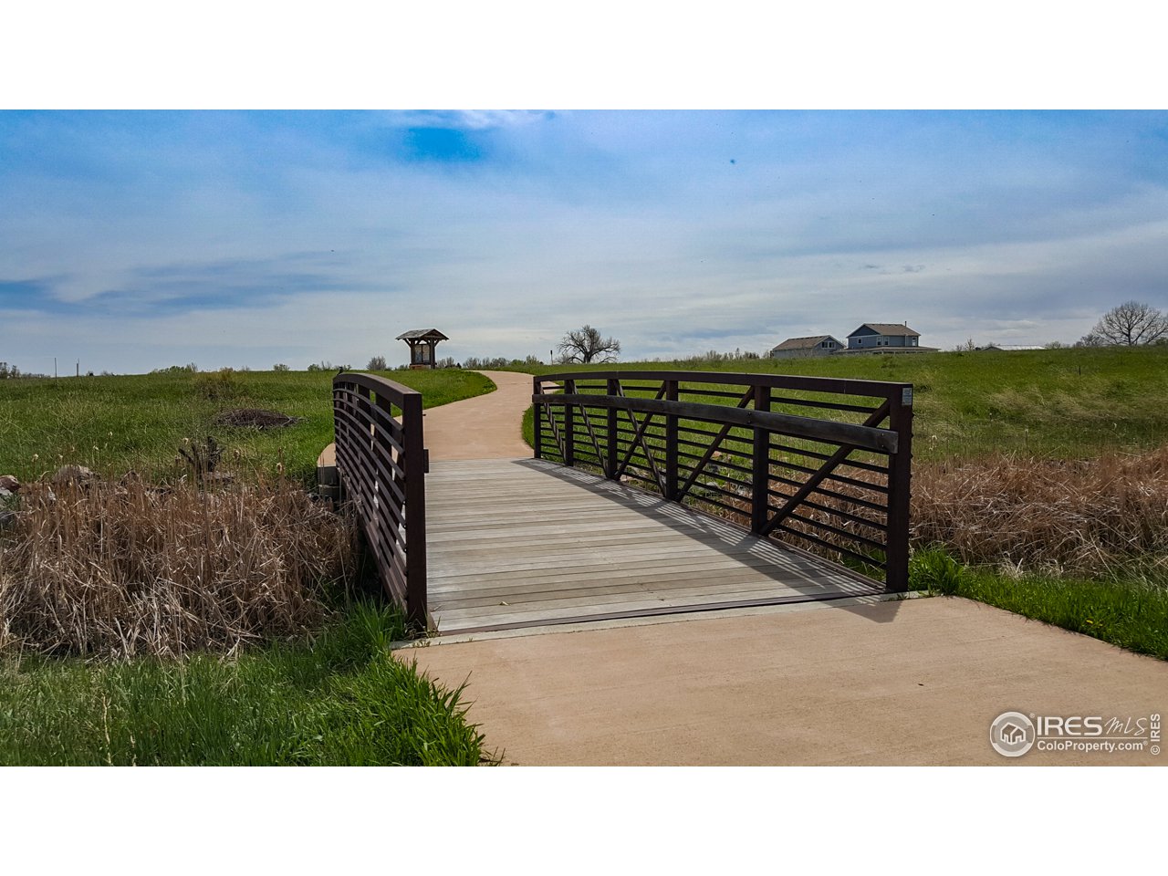 6827 Autumn Ridge Drive, Unit 3 Fort Collins, CO 80525 - Photo 28 of 35 Bridge invites you over from playground to nature.