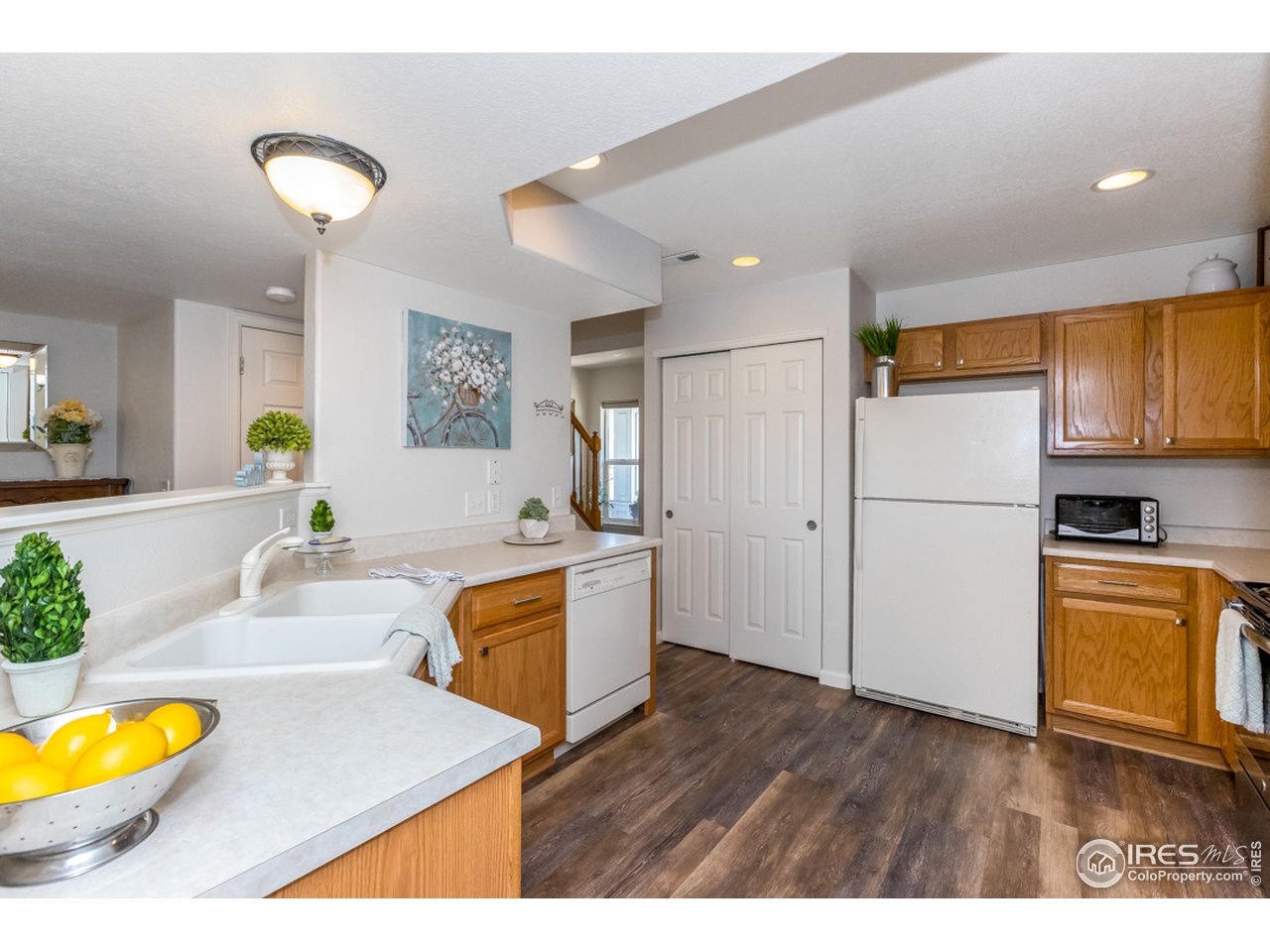6827 Autumn Ridge Drive, Unit 3 Fort Collins, CO 80525 - Photo 5 of 35 Spacious pantry to side of refrigerator.