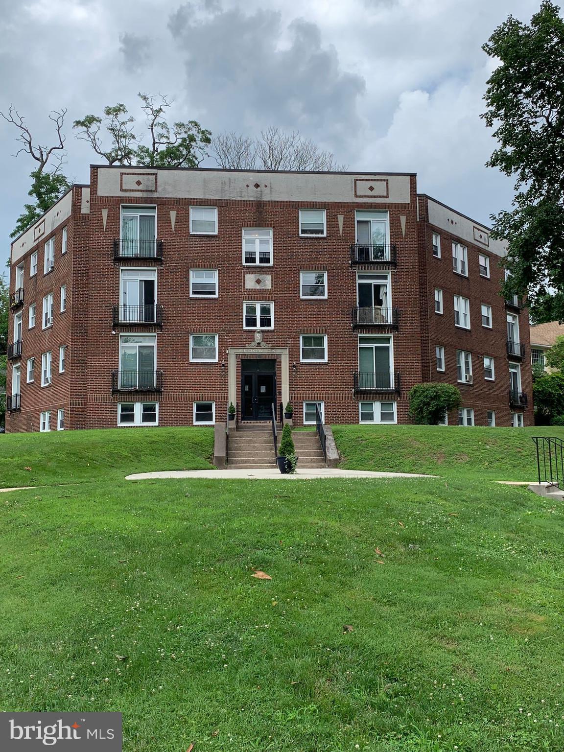 617-625 East Vernon Road, Unit 3A Philadelphia, PA 19119 - Photo 2 of 14 a view of a building with a yard