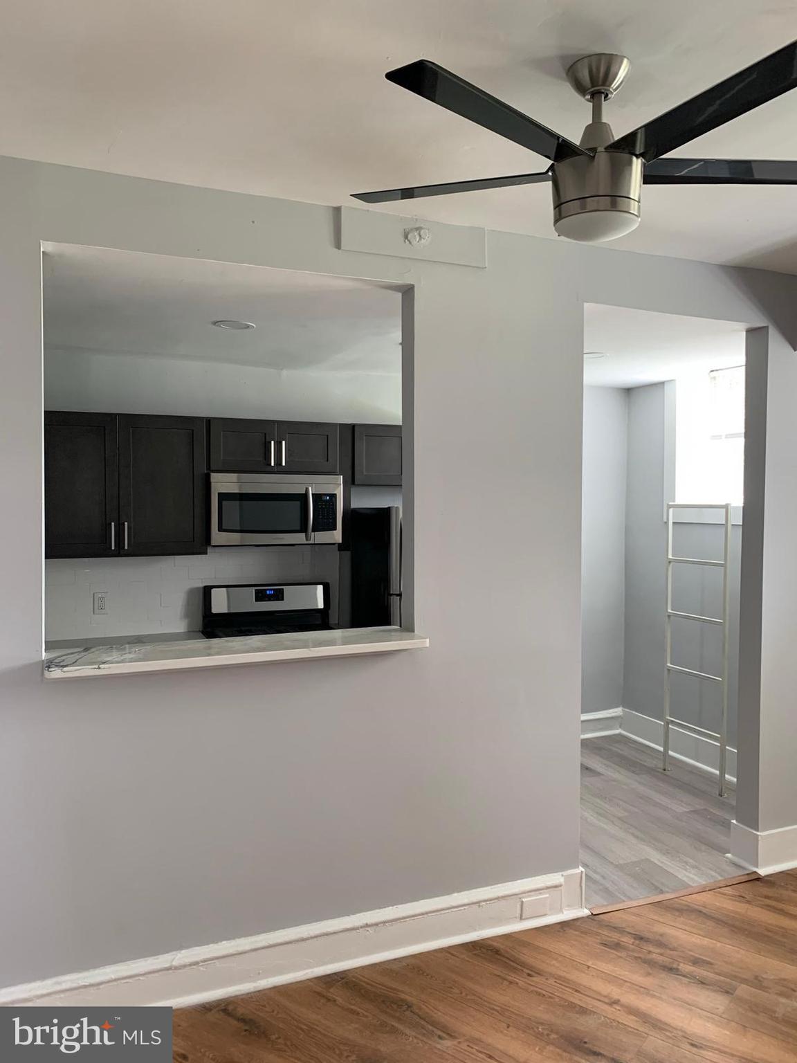 617-625 East Vernon Road, Unit 3A Philadelphia, PA 19119 - Photo 5 of 14 a view of a storage and utility room with wooden floor