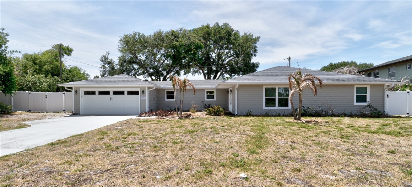 7989 143rd Street Sebastian, FL 32958 - Photo 2 of 30 a house with trees in front of it