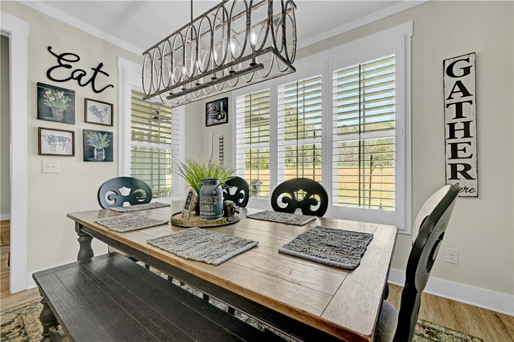 670 Poplar Street Monroe, GA 30655 - Photo 14 of 26 a view of a workspace with furniture and a window