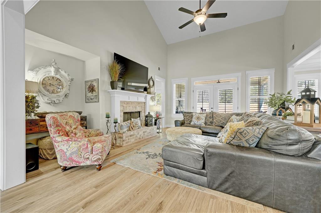 670 Poplar Street Monroe, GA 30655 - Photo 20 of 26 a living room with fireplace furniture and a flat screen tv