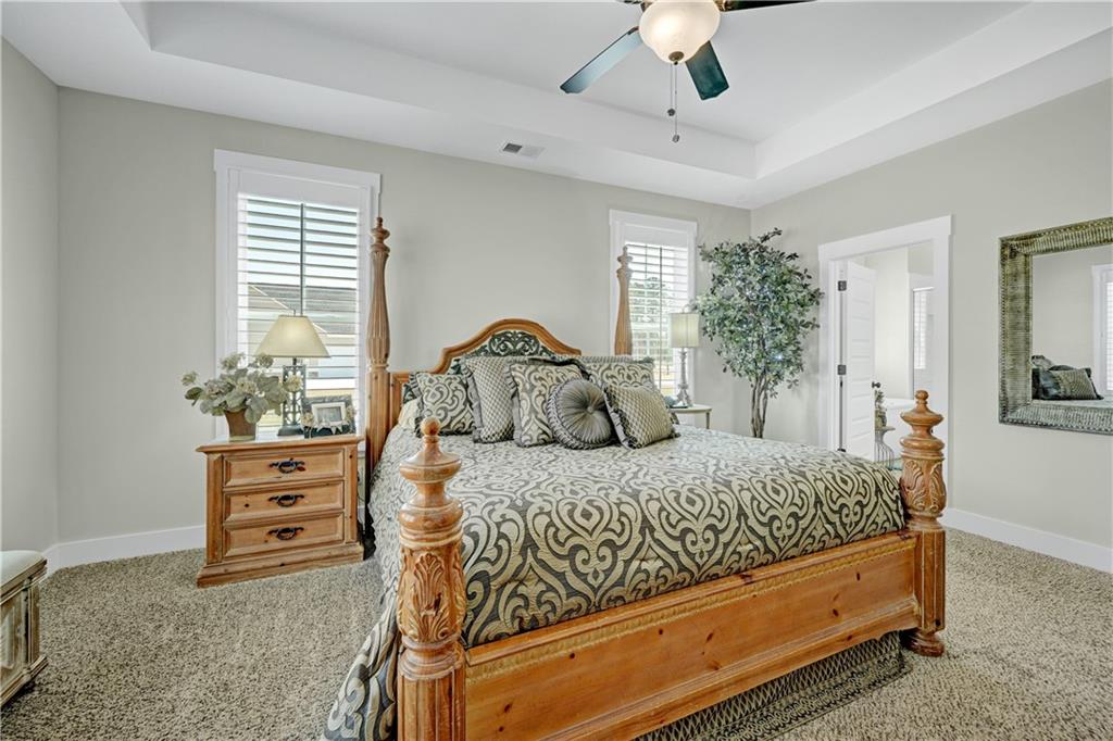 670 Poplar Street Monroe, GA 30655 - Photo 22 of 26 a bedroom with a bed and a dresser