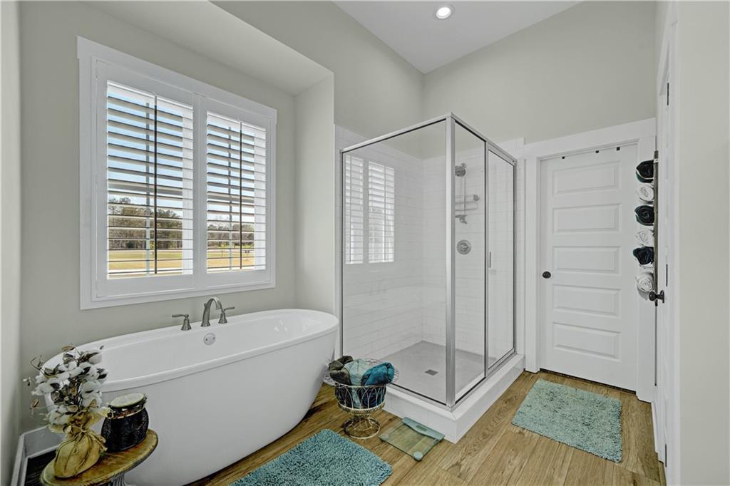 670 Poplar Street Monroe, GA 30655 - Photo 23 of 26 a bathroom with a bathtub and a shower