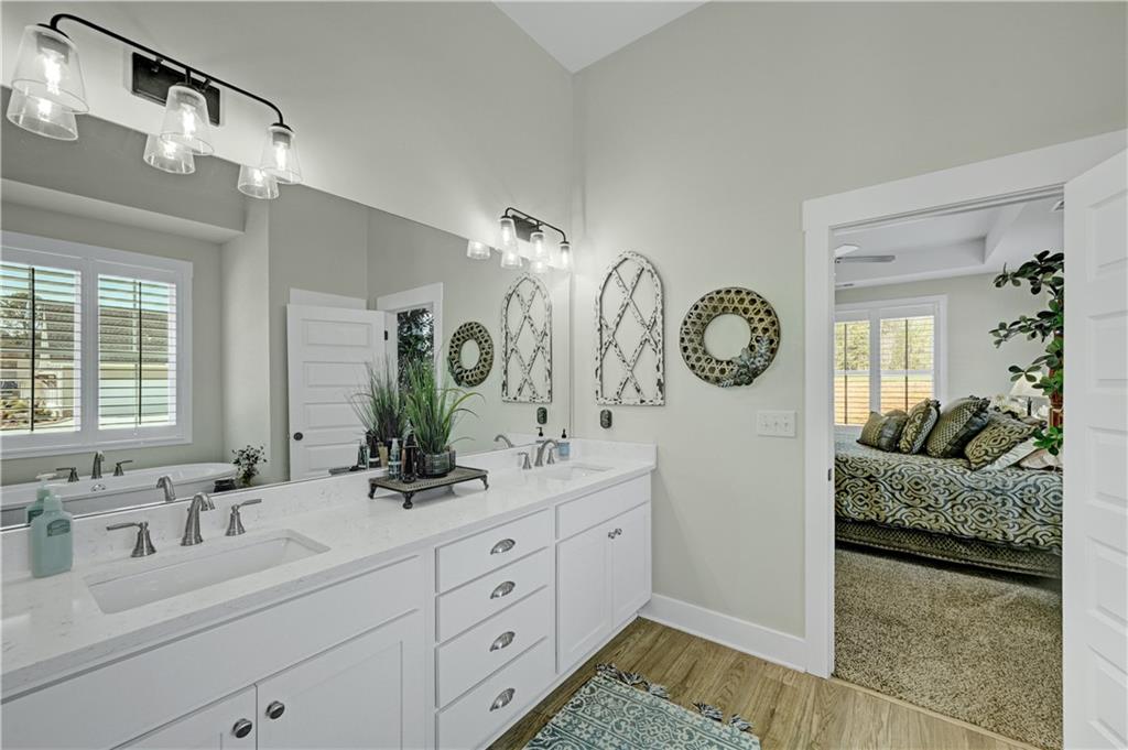 670 Poplar Street Monroe, GA 30655 - Photo 24 of 26 a spacious bathroom with double vanity and a mirror