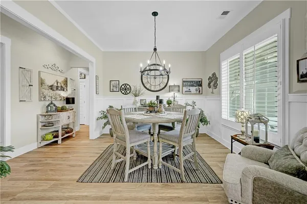 a dining room with furniture window wooden floor