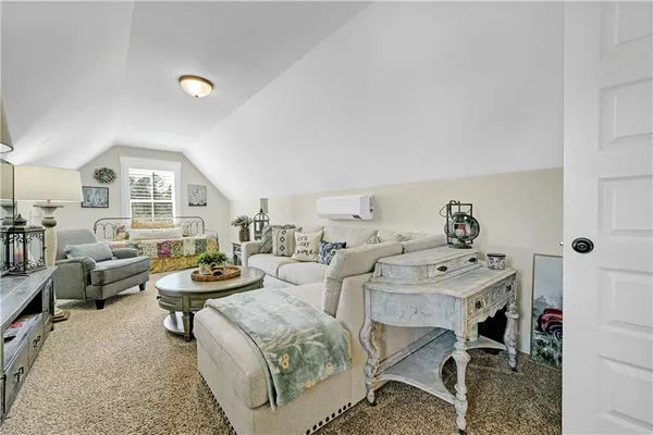 a view of a livingroom with furniture and a livingroom