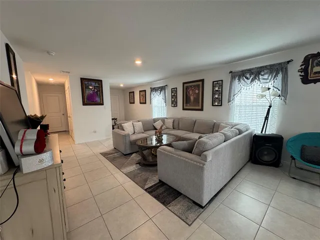 a living room with furniture and a window