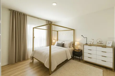 a bedroom with a bed and a table in it