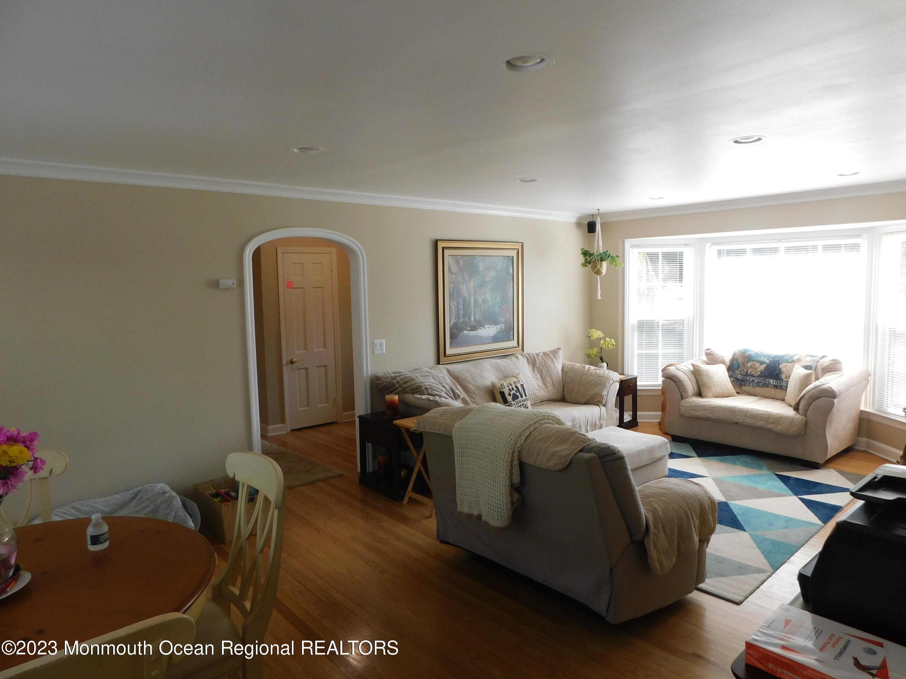 295 Broadway Freehold, NJ 07728 - Photo 13 of 39 a living room with furniture windows and a flat screen tv