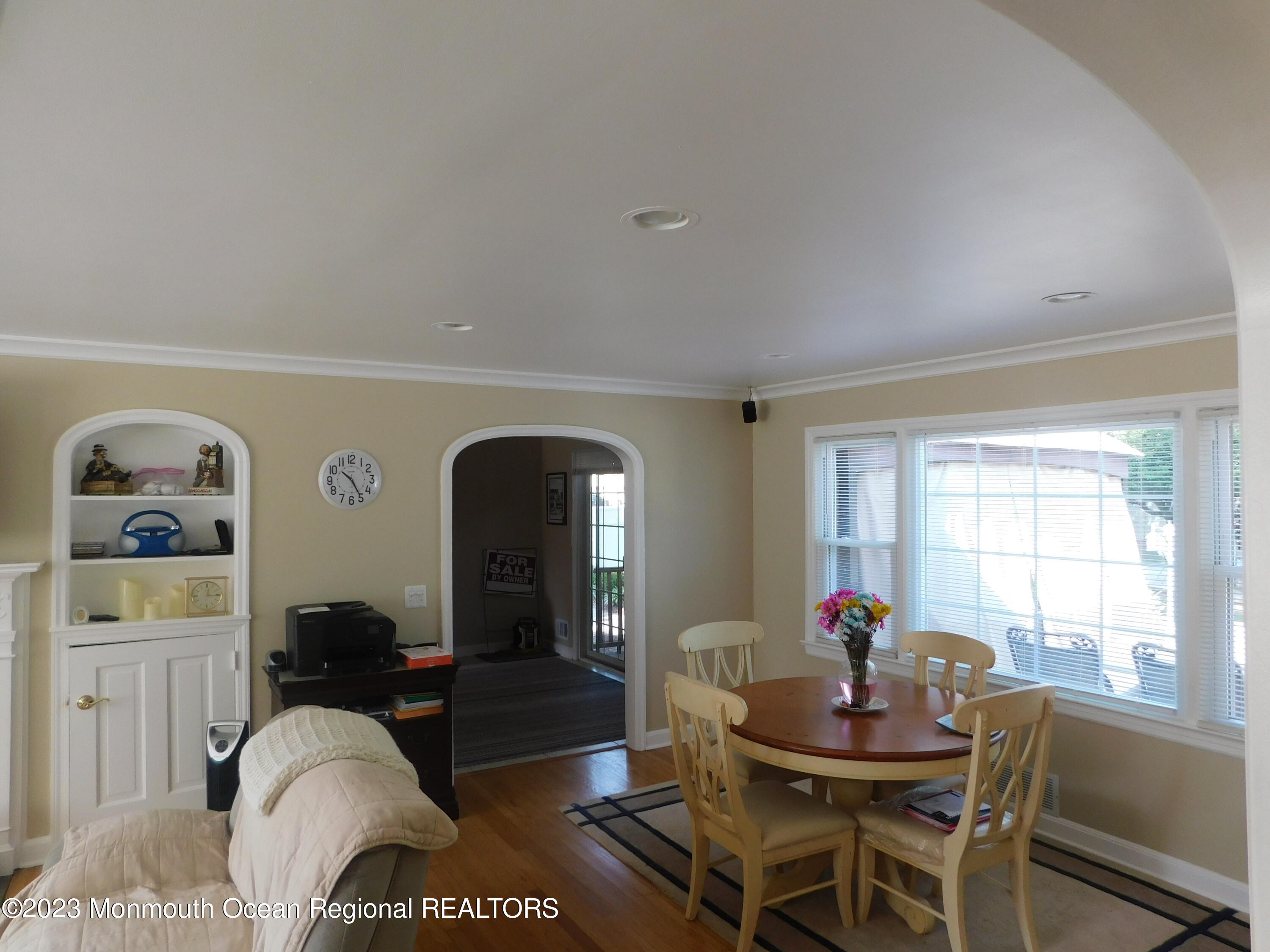 295 Broadway Freehold, NJ 07728 - Photo 16 of 39 a living room with furniture a window and wooden floor