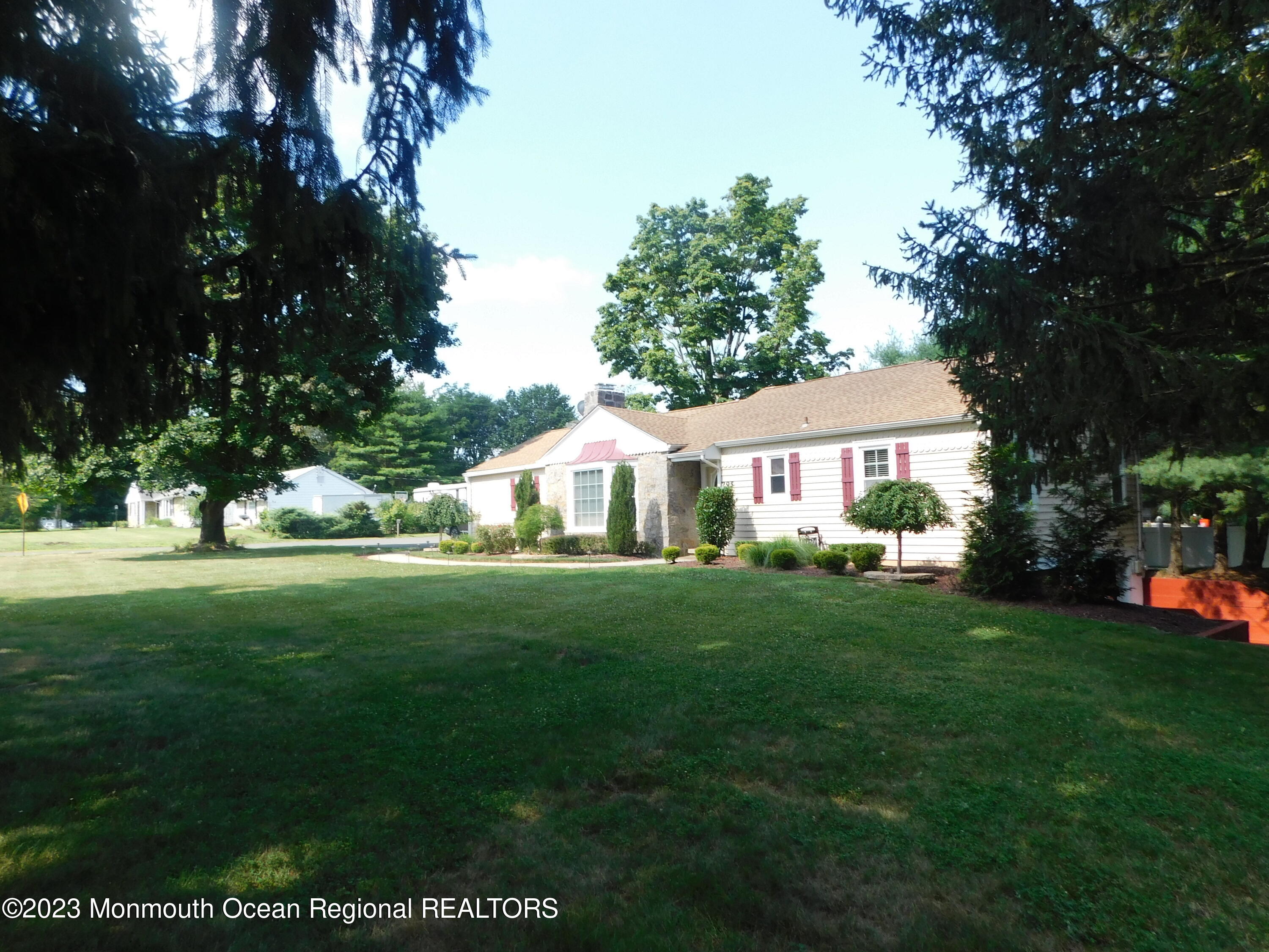 295 Broadway Freehold, NJ 07728 - Photo 17 of 39 a front view of a house with garden