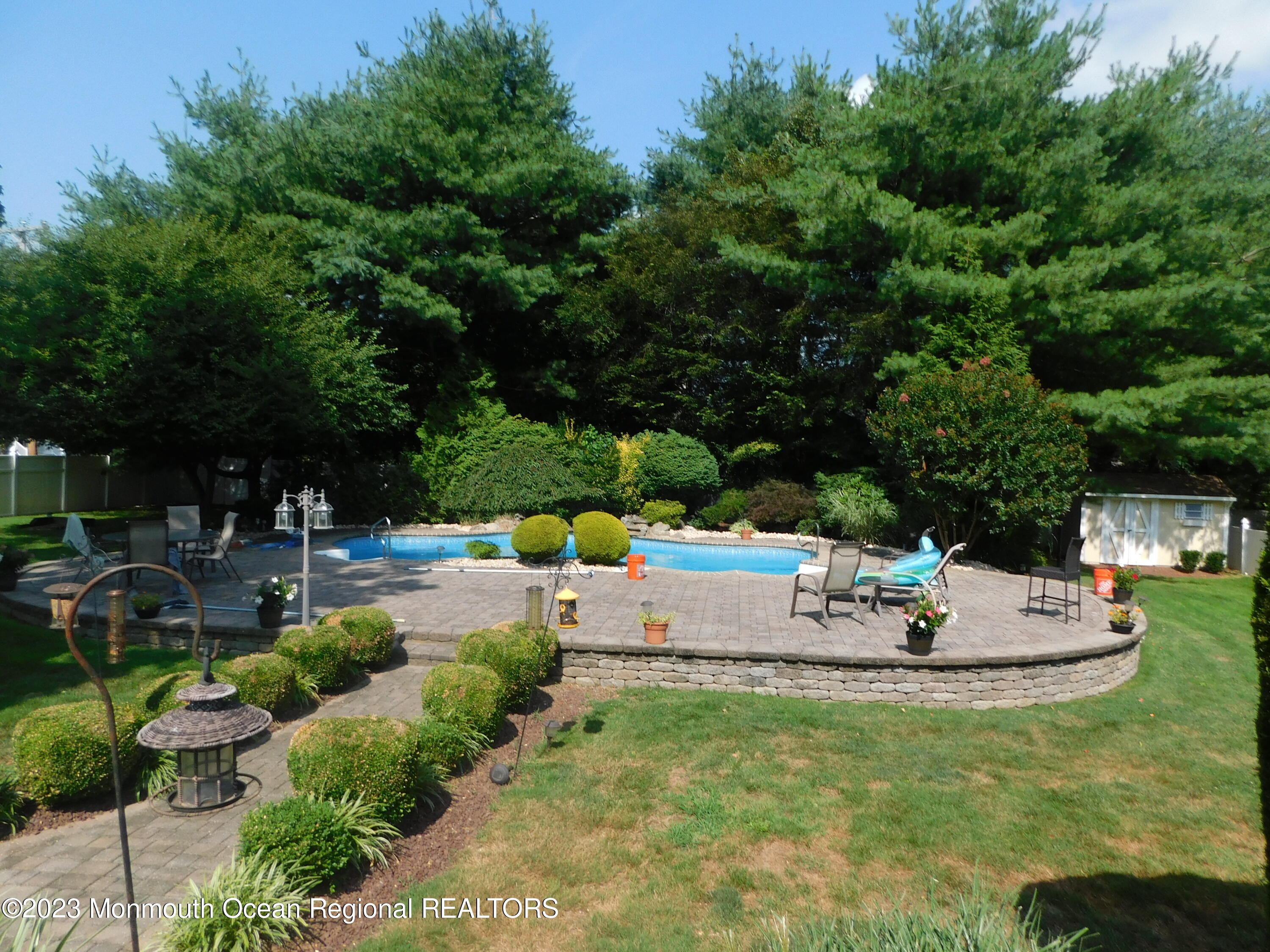 295 Broadway Freehold, NJ 07728 - Photo 21 of 39 a view of a swimming pool with a patio
