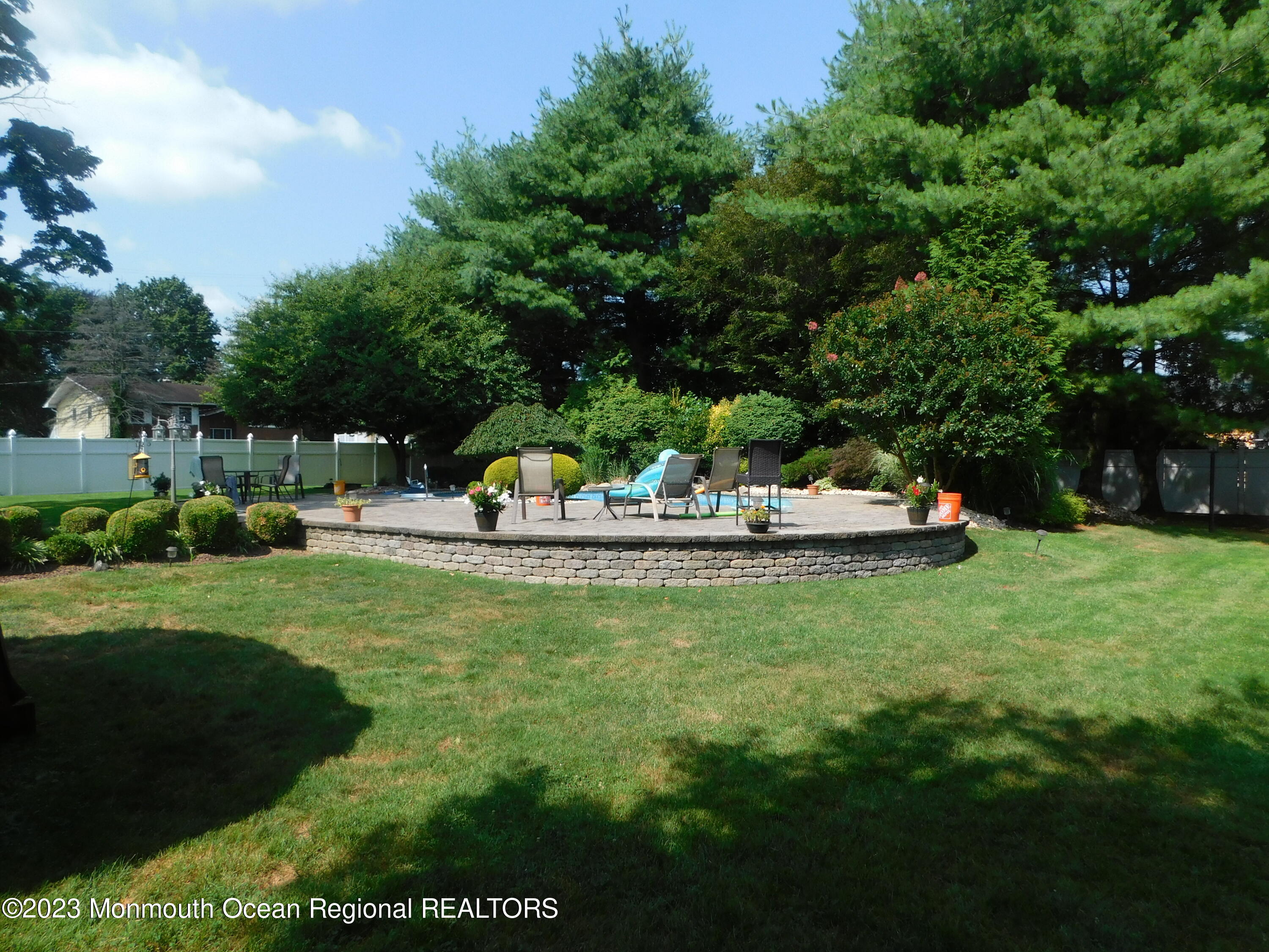 295 Broadway Freehold, NJ 07728 - Photo 25 of 39 a view of a table and chairs in the garden