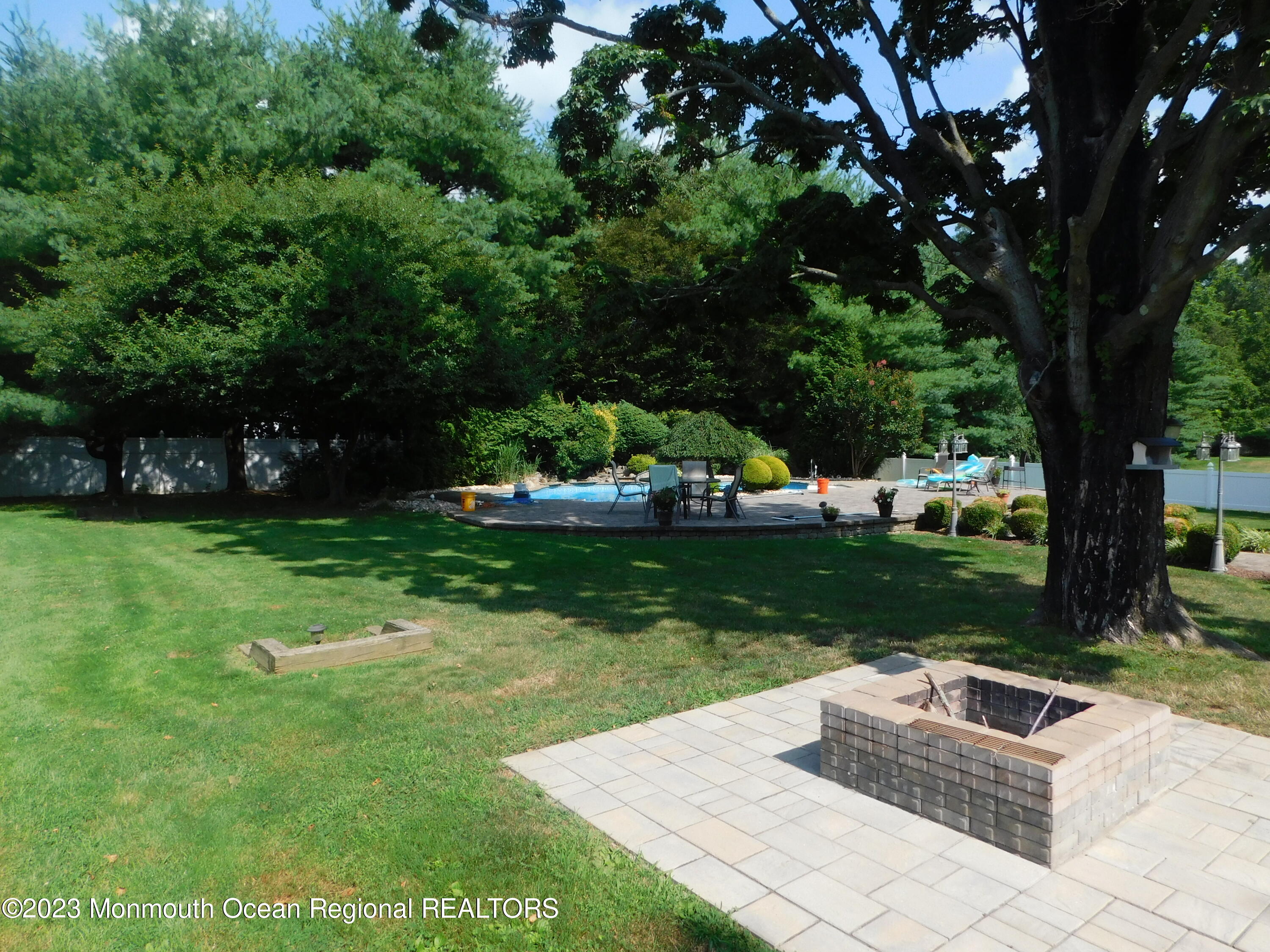 295 Broadway Freehold, NJ 07728 - Photo 27 of 39 a view of a garden with lawn chairs