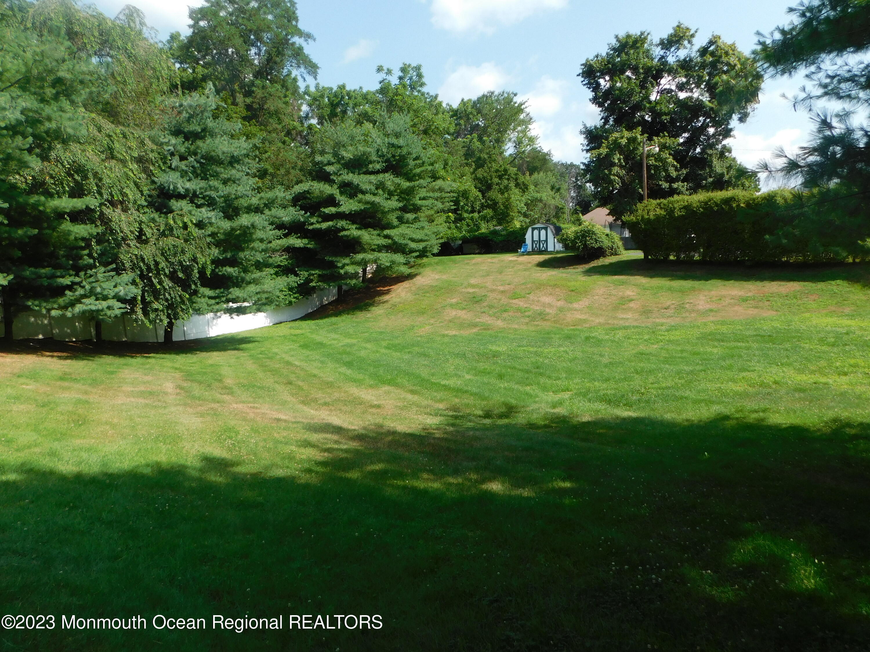 295 Broadway Freehold, NJ 07728 - Photo 29 of 39 a view of an outdoor space and a yard