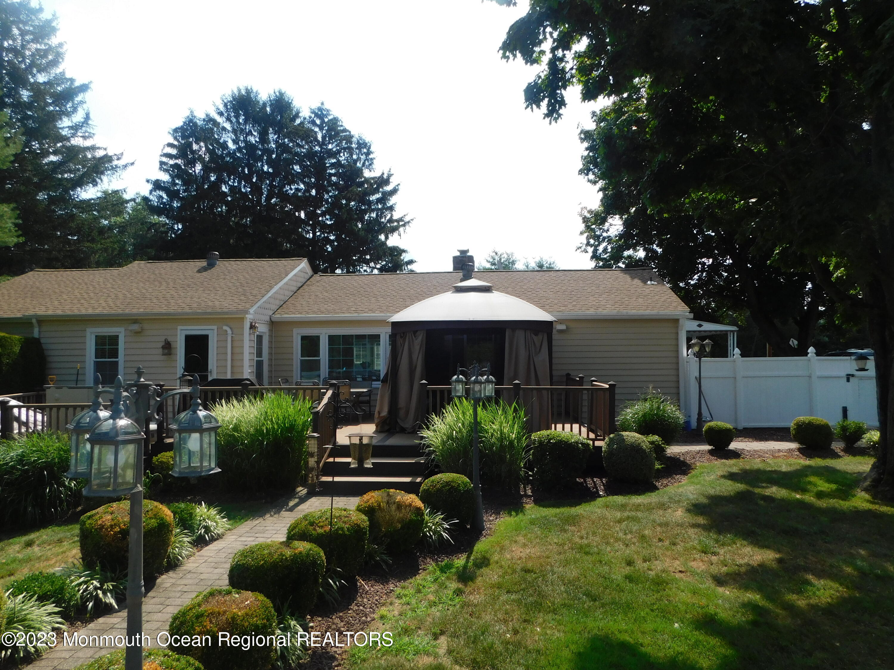 295 Broadway Freehold, NJ 07728 - Photo 30 of 39 a front view of house with yard and outdoor seating