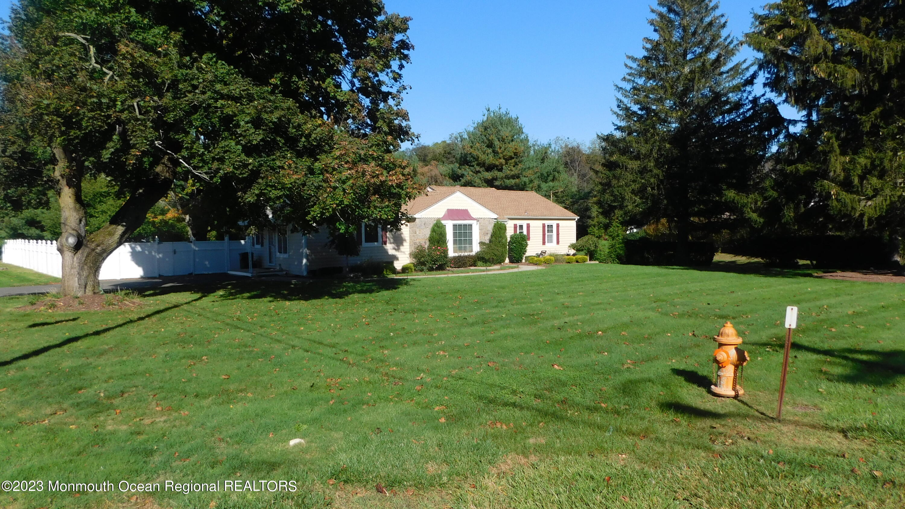 295 Broadway Freehold, NJ 07728 - Photo 38 of 39 a view of a house with a yard porch and sitting area