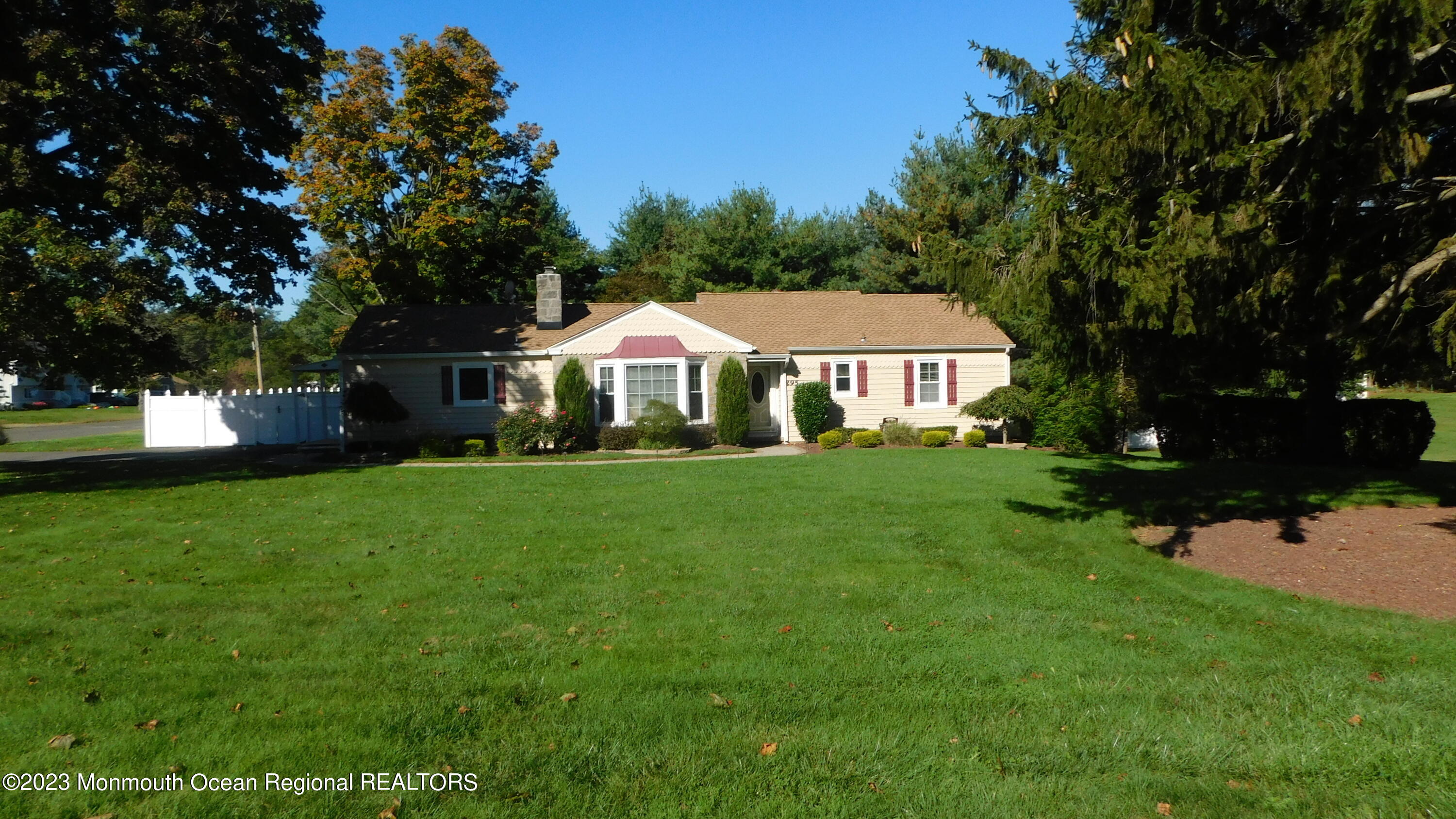 295 Broadway Freehold, NJ 07728 - Photo 39 of 39 a front view of a house with a yard