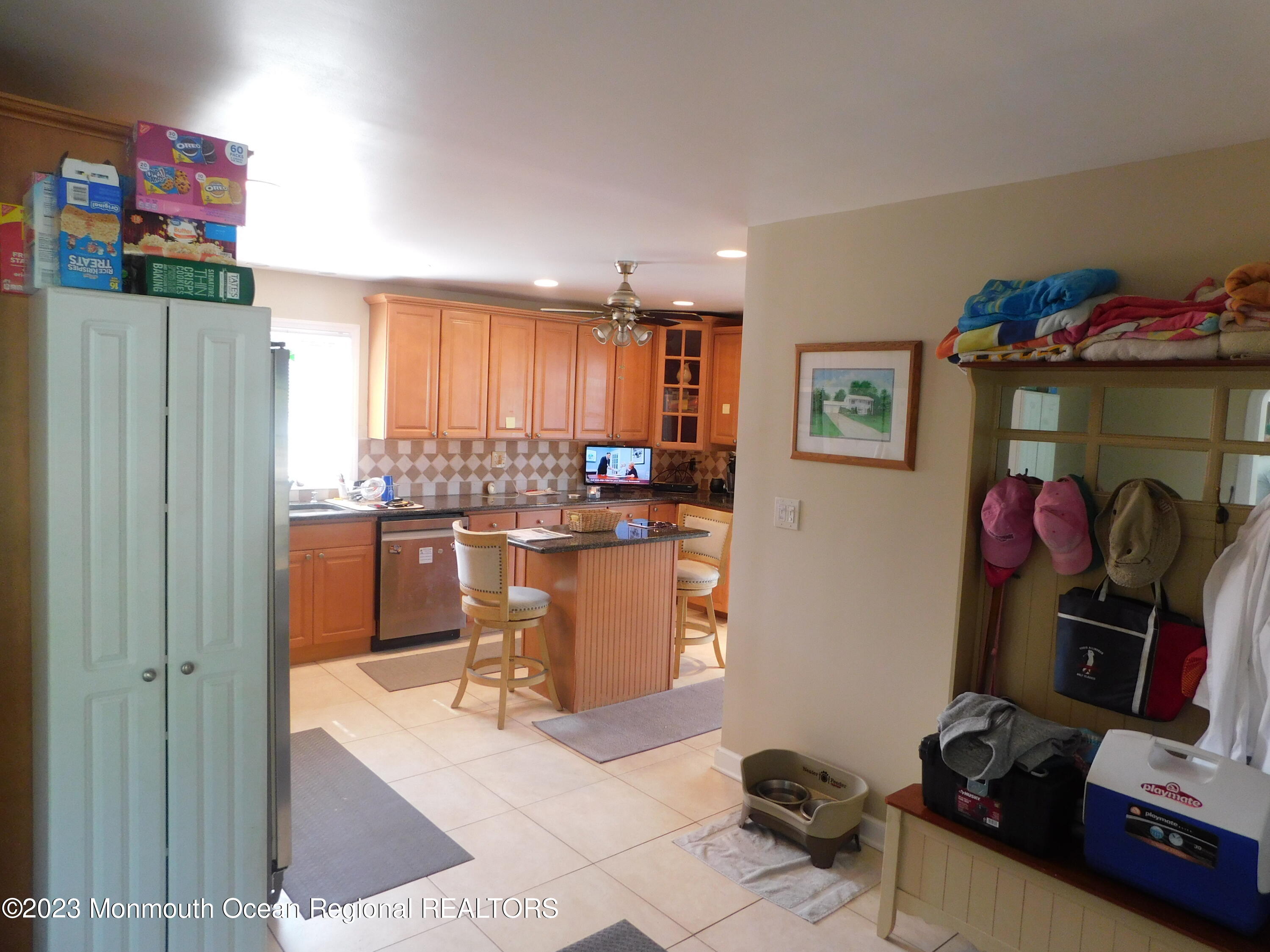 295 Broadway Freehold, NJ 07728 - Photo 4 of 39 a kitchen with a refrigerator and a counter top space