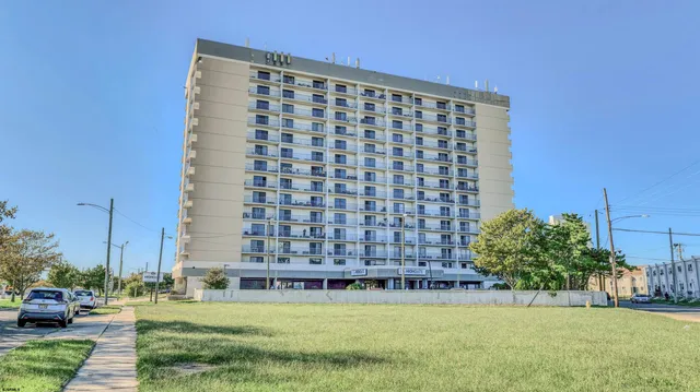 a view of building with yard