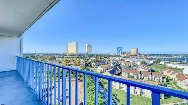 a view of a balcony with city