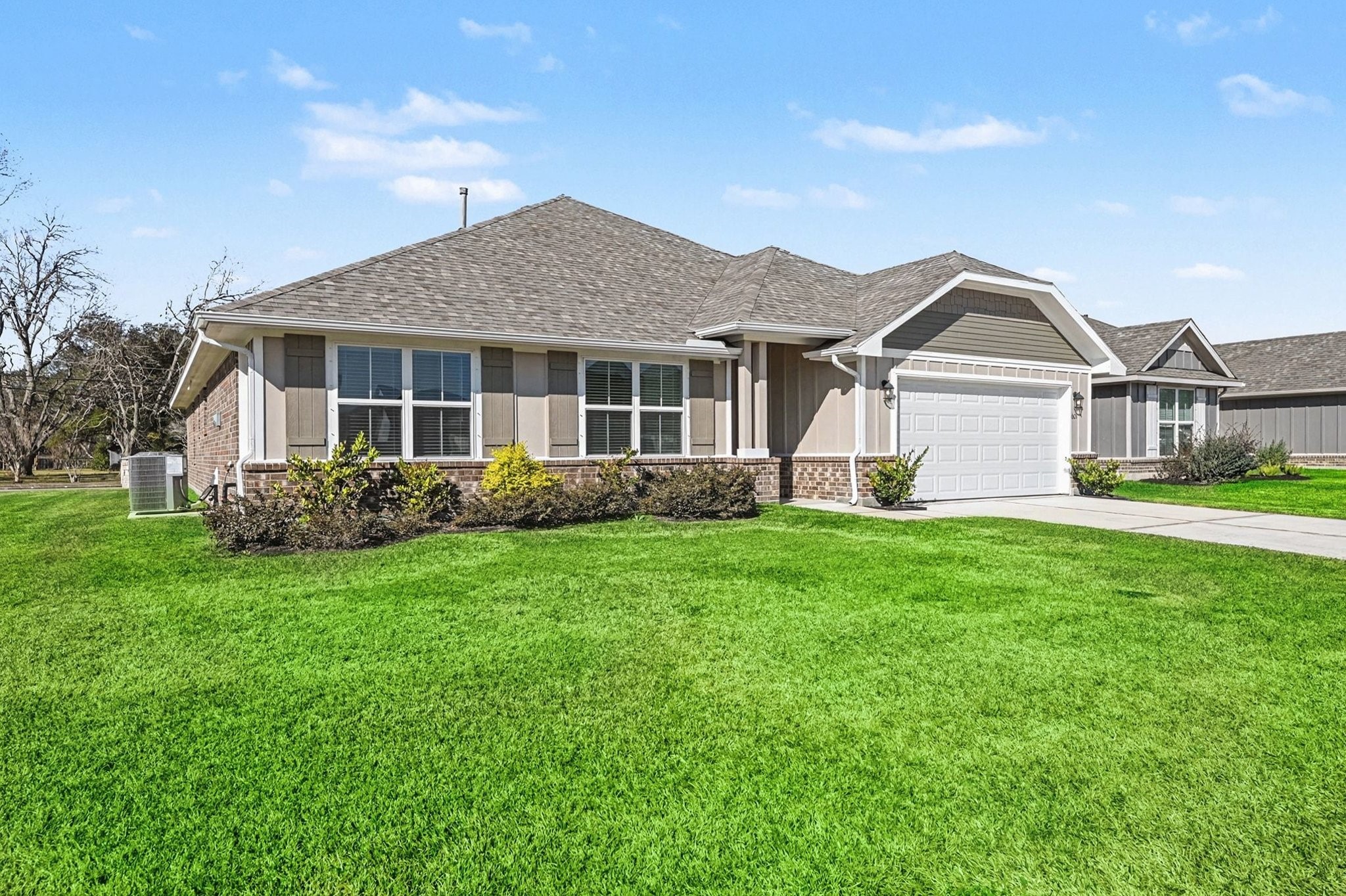 601 Greystone Lane Angleton, TX 77515 - Photo 4 of 32 a view of a house with garden