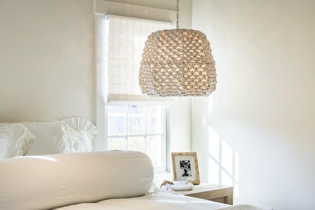 a living room with a couch and a large window