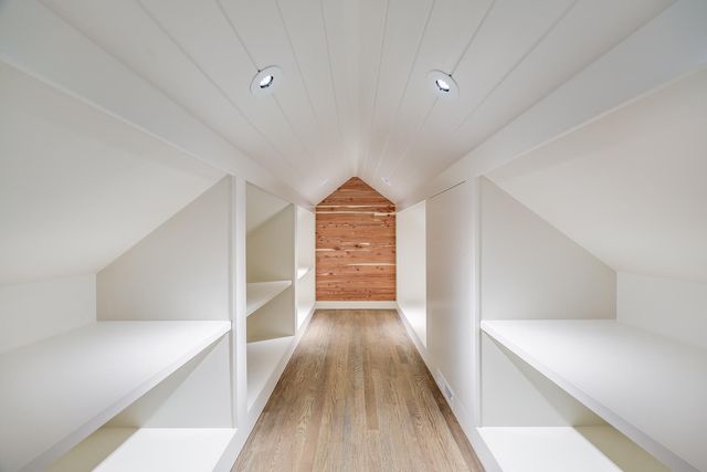 a view of hallway with wooden floor