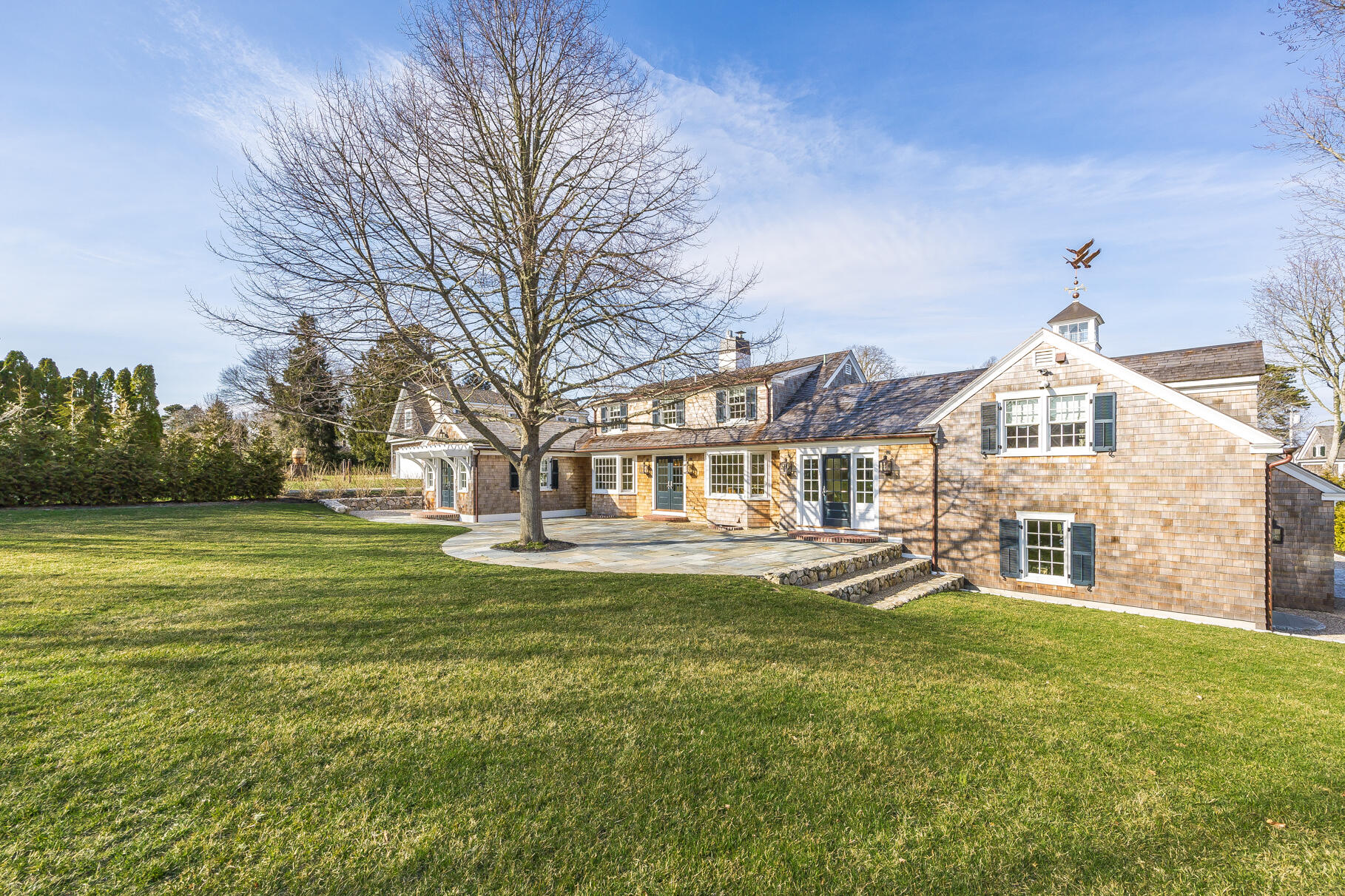 149 East Bay Road Osterville, MA 02655 - Photo 23 of 29 a large white building with a big yard and large trees