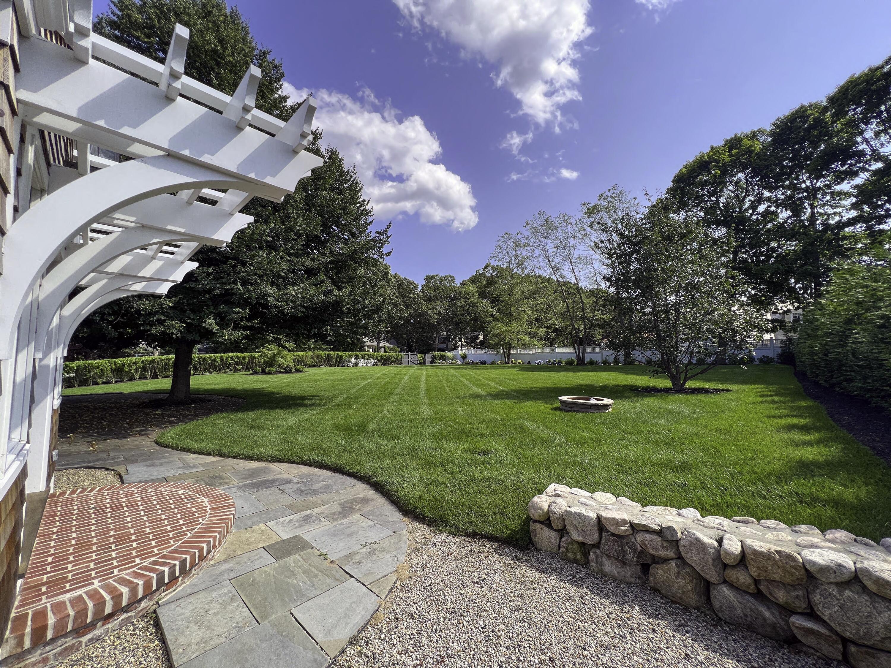 149 East Bay Road Osterville, MA 02655 - Photo 25 of 29 a view of a garden with an outdoor space