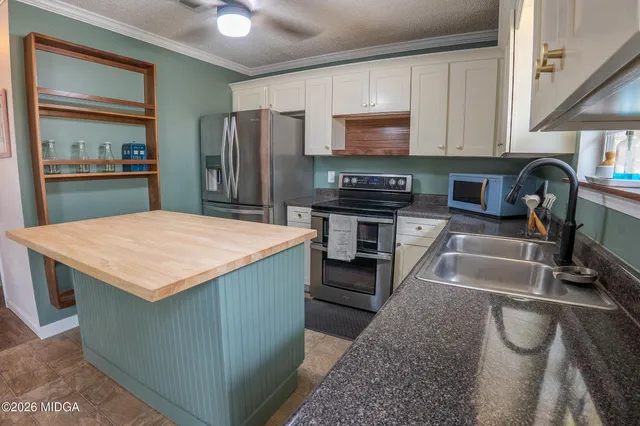 a view of a dining room with furniture and window