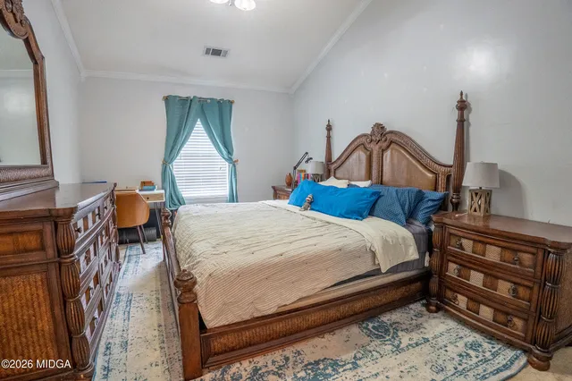 a view of a hallway with a wooden door