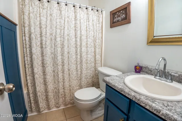 a kitchen with stainless steel appliances a sink stove refrigerator and a window