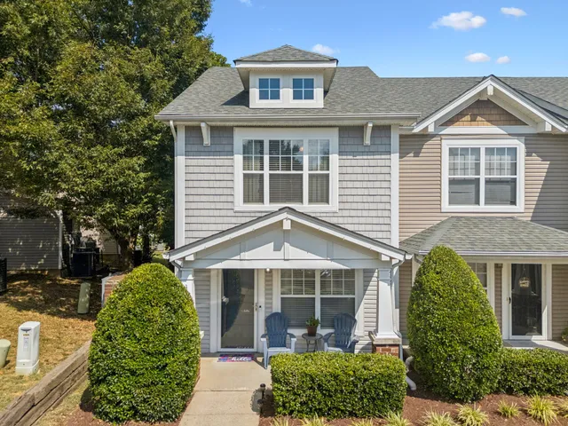 front view of a house with a garden
