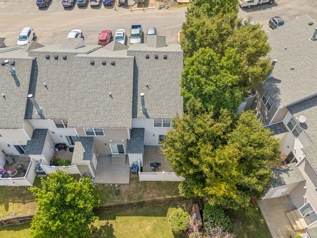 an aerial view of a house with outdoor space