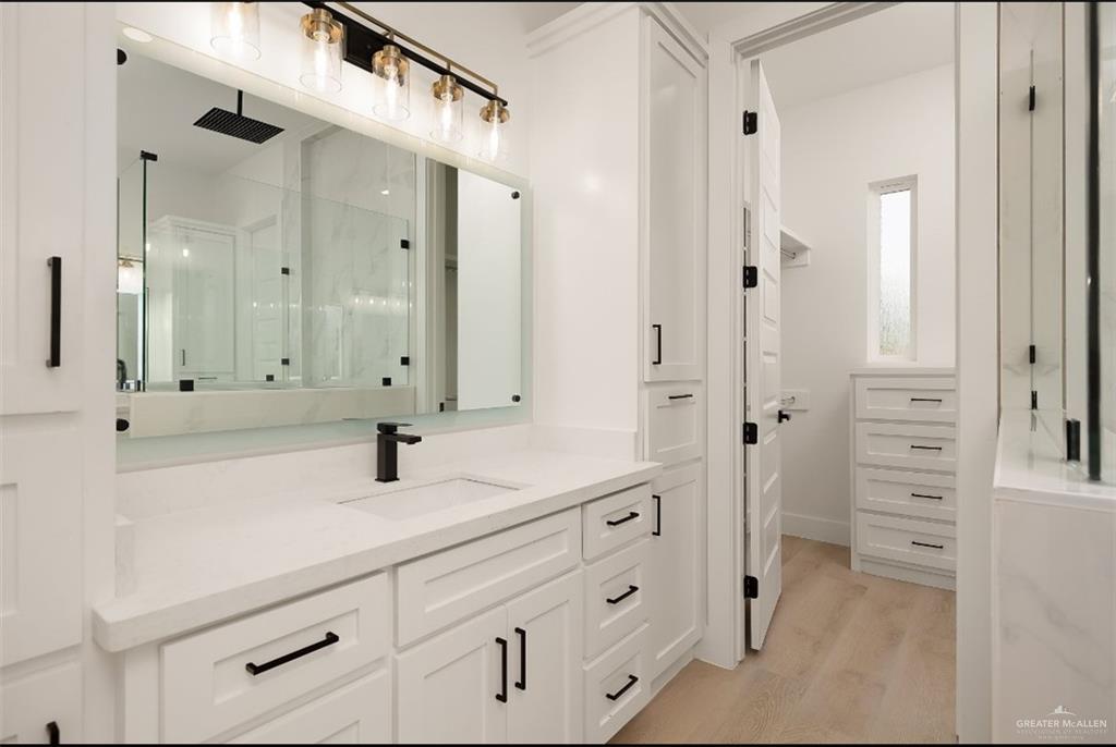 8003 North 55th Lane McAllen, TX 78573 - Photo 12 of 20 a bathroom with a double vanity sink mirror and shower
