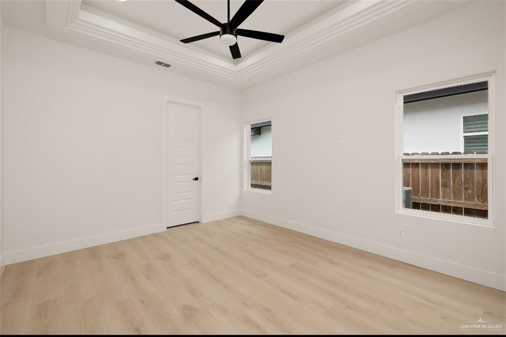 8003 North 55th Lane McAllen, TX 78573 - Photo 16 of 20 an empty room with a window