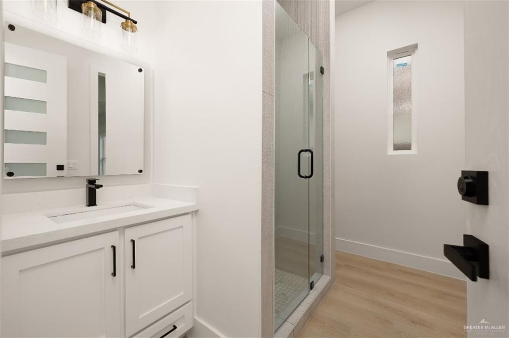 8003 North 55th Lane McAllen, TX 78573 - Photo 17 of 20 a bathroom with a sink and mirror