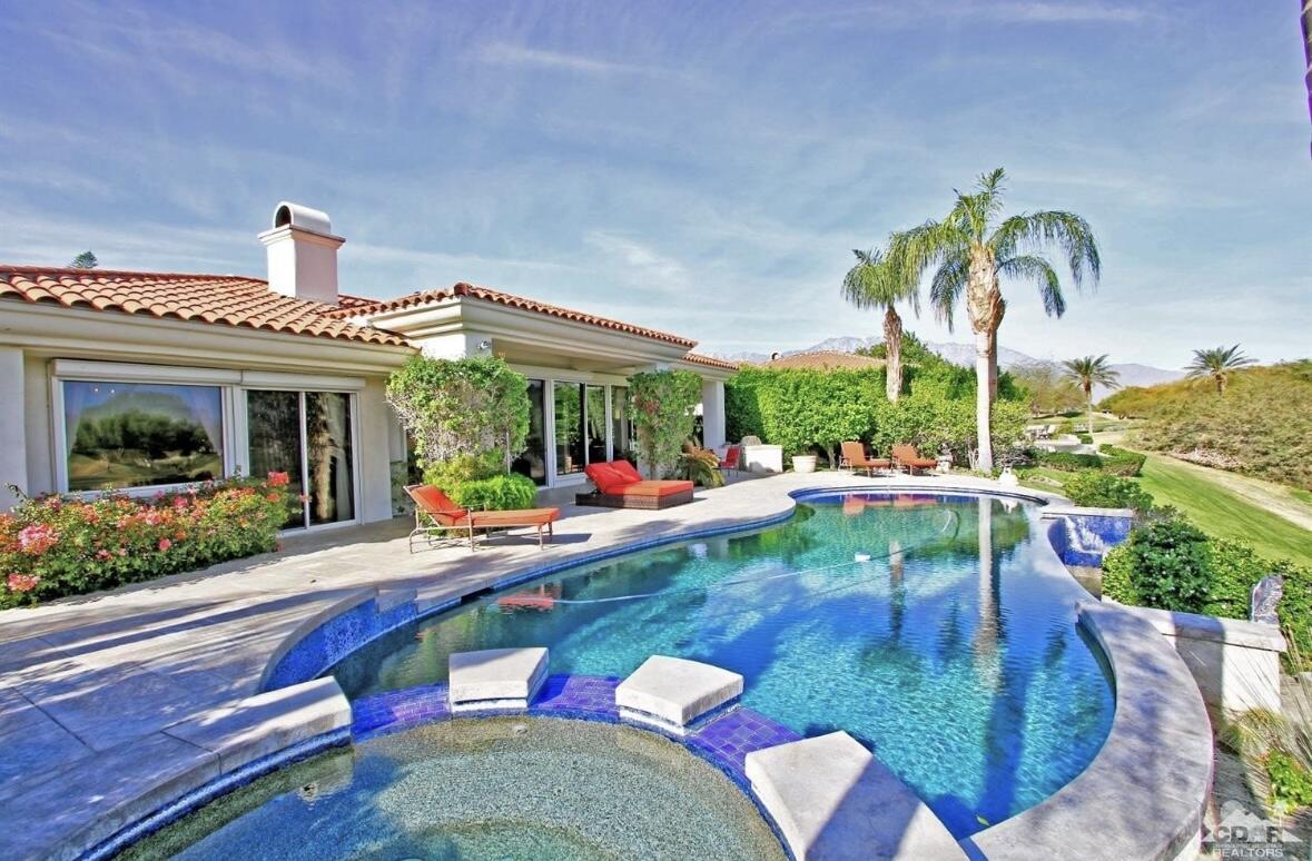 104 Loch Lomond Road Rancho Mirage, CA 92270 - Photo 11 of 27 a view of a swimming pool with a patio
