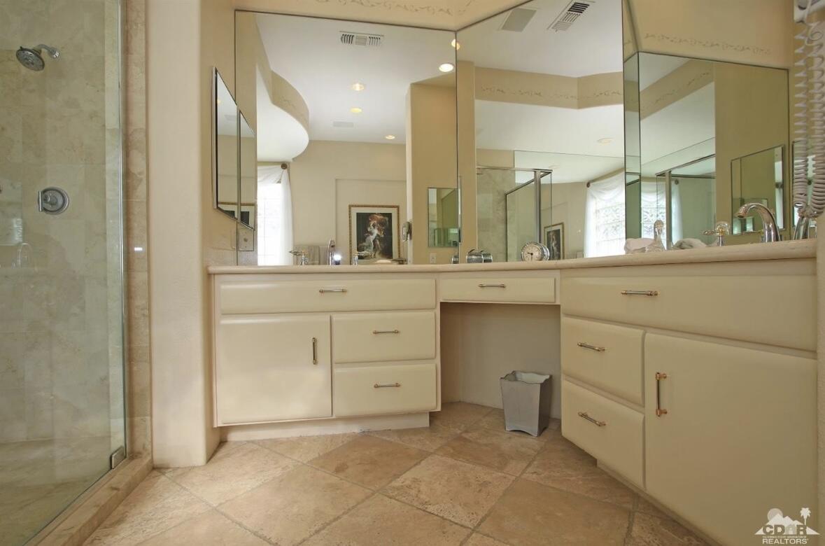 104 Loch Lomond Road Rancho Mirage, CA 92270 - Photo 15 of 27 a bathroom with a sink and a mirror