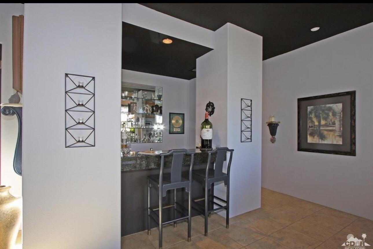 104 Loch Lomond Road Rancho Mirage, CA 92270 - Photo 27 of 27 a view of a dining room with furniture