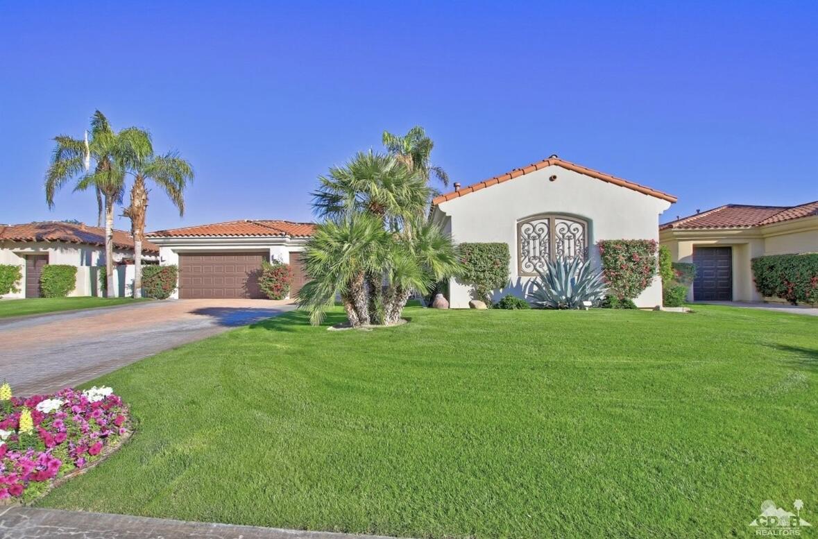 104 Loch Lomond Road Rancho Mirage, CA 92270 - Photo 4 of 27 a front view of a house with garden